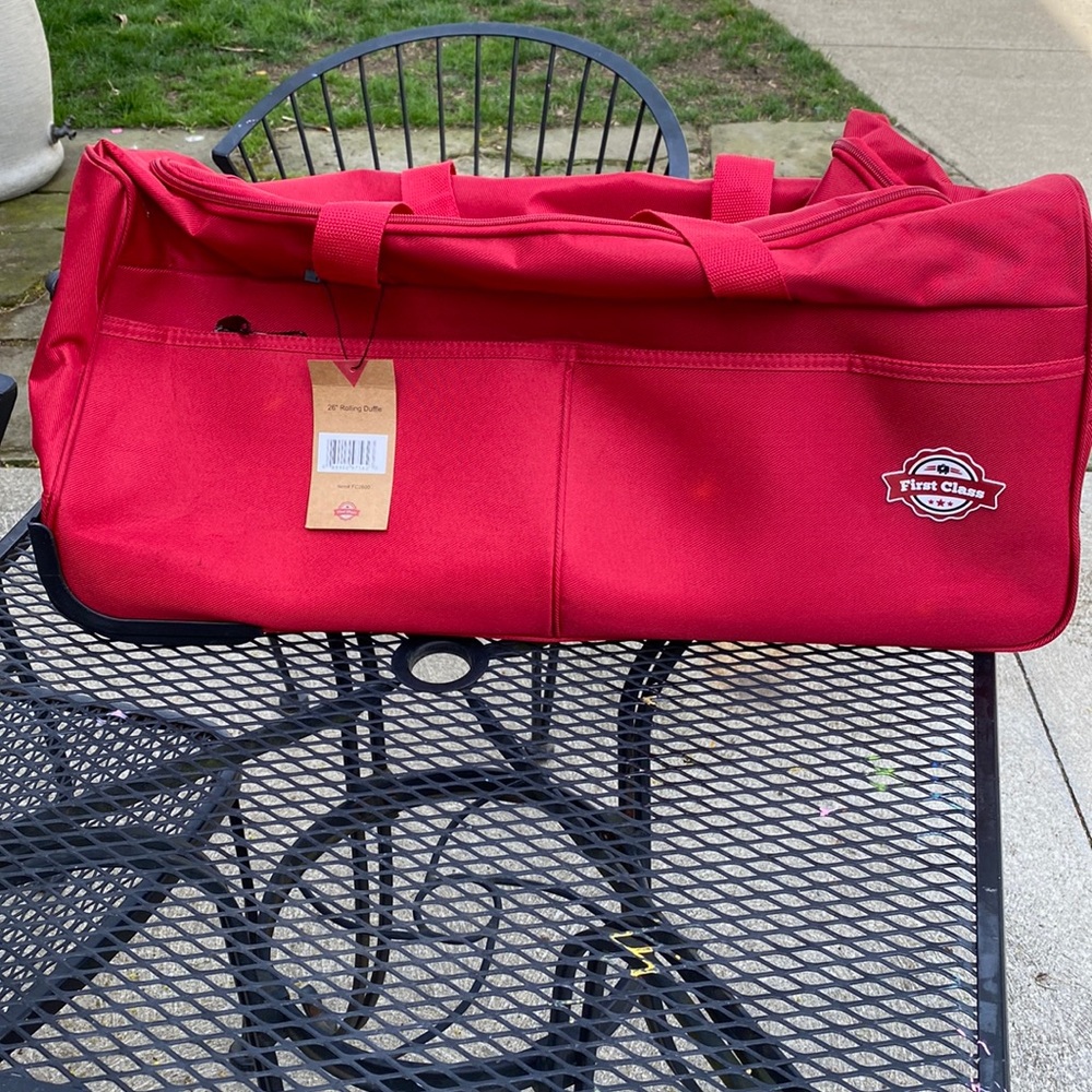 First Class 26” rolling duffel bag NWT
